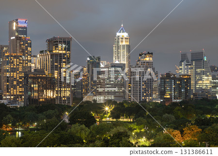 the illuminated high-rise buildings and skyscrapers of Bangkok city at night. the illuminated high-rise buildings and skyscrapers of Bangkok city at night. 131386611
