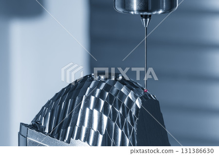 The CMM machine measure the head light lens reflection mold parts in the light blue scene. 131386630