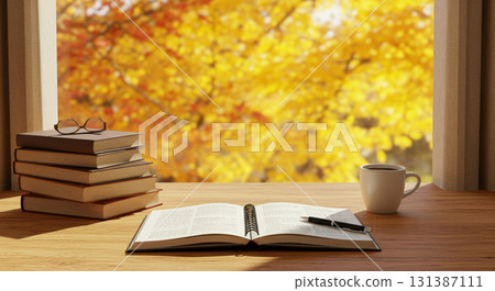 Books and coffee cups on a wooden desk in an autumn atmosphere 131387111
