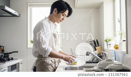 Husband washing dishes 131387561