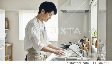 Husband washing dishes Husband washing dishes 131387562