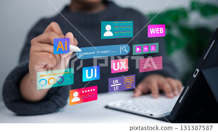Designer working on tablet with UI UX AI web development technology interface concept Designer working on tablet with UI UX AI web development technology interface concept 131387587