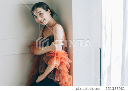 A woman wearing a black wedding dress and makeup 131387981