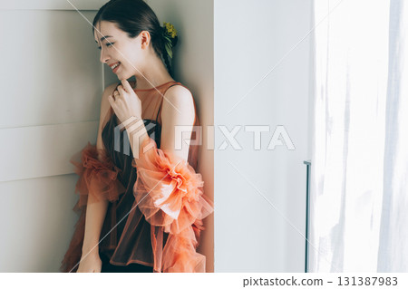 A woman wearing a black wedding dress and makeup 131387983