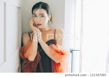 A woman wearing a black wedding dress and makeup 131387985