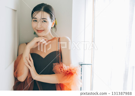 A woman wearing a black wedding dress and makeup 131387988