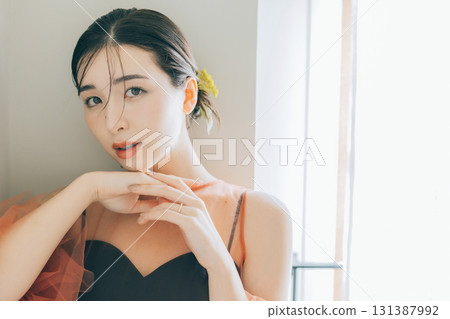 A woman wearing a black wedding dress and makeup 131387992