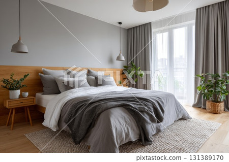 Cozy bedroom with natural light, plants, and soft textures for sleep tourism concept 131389170