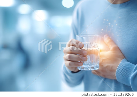 Drinking water helps clear stomach discomfort. 131389266