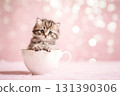 A cute cat sits inside a teacup. 131390306