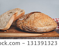 Homemade sourdough bread slices on kitchen table 131391323