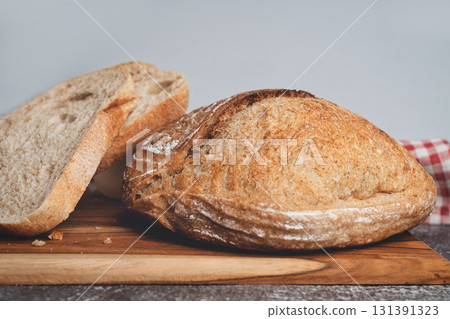 Homemade sourdough bread slices on kitchen table 131391323