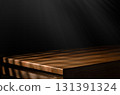 Wooden tabletop with dramatic light and shadow 131391324