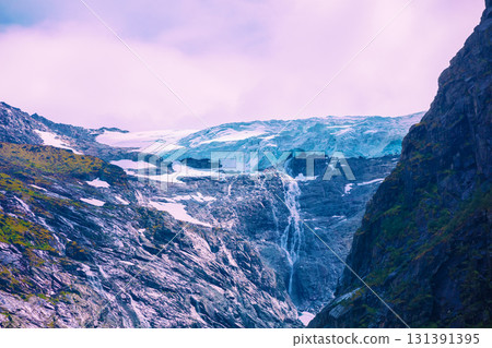 Briksdal glacier hike. Briksdalsbreen Mountain during sunrise. Norway Briksdal glacier hike. Briksdalsbreen Mountain during sunrise. Norway 131391395