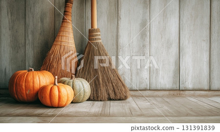 Halloween, with antique witches' brooms, pumpkins and autumn leaves. 131391839