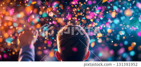 Celebration with Colorful Confetti in the Air and a Person Raising Their Hand Celebration with Colorful Confetti in the Air and a Person Raising Their Hand 131391952