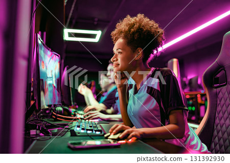 Dedicated Focused Gamer Excelling In A Modern And Innovative Esports Setup Experience Dedicated Focused Gamer Excelling In A Modern And Innovative Esports Setup Experience 131392930