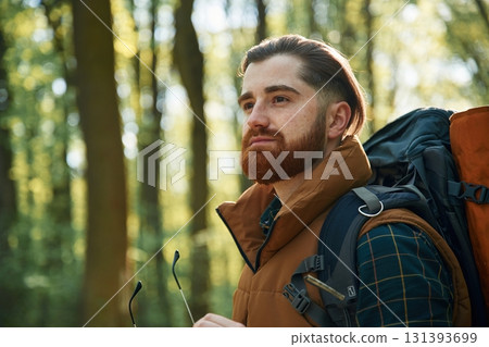Bearded man is in the forest at daytime Bearded man is in the forest at daytime 131393699