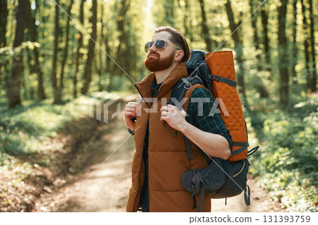Bearded man is in the forest at daytime 131393759