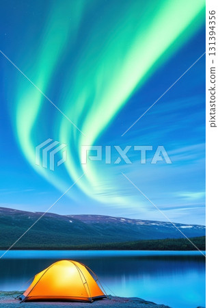 Serene lake reflects vibrant green and purple auroras with a glowing tent at night under a starry sky 131394356
