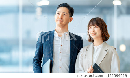 Image of business teamwork between two men and women 131394919