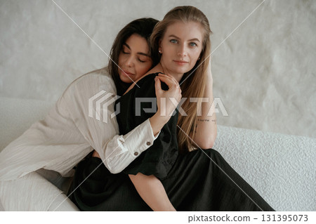 Closeness of the people. Two happy young female best friends are indoors Closeness of the people. Two happy young female best friends are indoors 131395073
