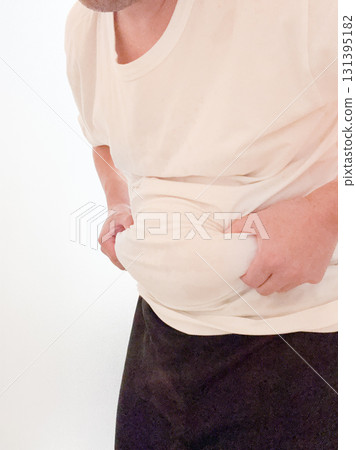 man removing belly fat man removing belly fat 131395182