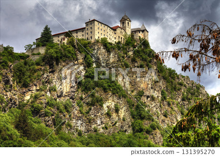 impressive castle on rock, north of Italy 131395270