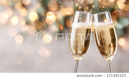 Two elegant champagne flutes clinking together, sparkling bubbles rising, with a festive bokeh background celebrating New Years Eve joy 131395325