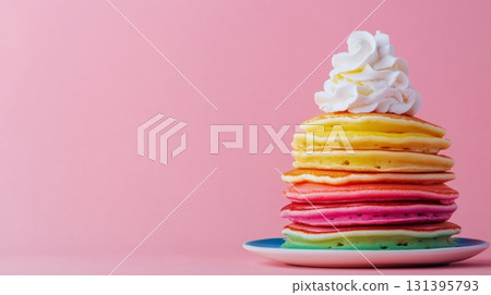 A vibrant stack of rainbow pancakes sits on a plate, beautifully topped with fluffy whipped cream, perfect for a delightful breakfast treat 131395793