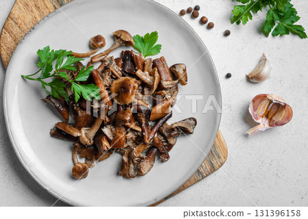 Fried Honey Mushrooms with garlic 131396158