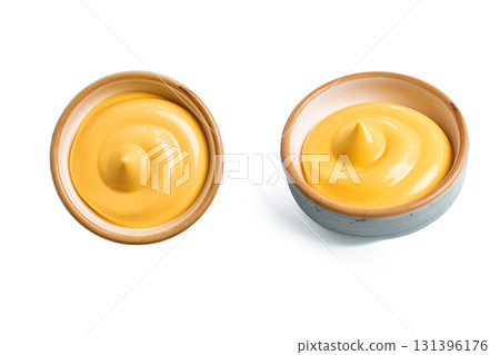 Cheese sauce in bowl isolated on white 131396176