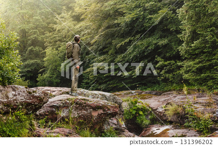 Hiker Enjoying Landscape during Solo Backpacking Trip Hiker Enjoying Landscape during Solo Backpacking Trip 131396202