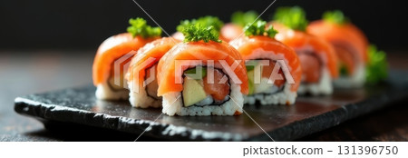 Philadelphia uramaki sushi rolls with salmon, avocado and cream cheese on black slate plate Philadelphia uramaki sushi rolls with salmon, avocado and cream cheese on black slate plate 131396750