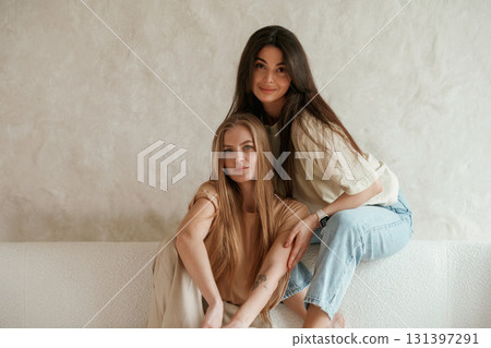 Best friends. Two happy young women are indoors Best friends. Two happy young women are indoors 131397291