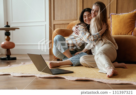 Happy playful free moments. Two young female best friends are indoors Happy playful free moments. Two young female best friends are indoors 131397321