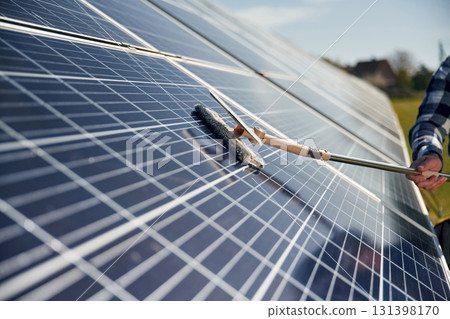 Close up view of cleaning solar panels surface 131398170