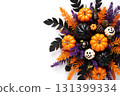 A vibrant Halloween display showcases orange, black, and white pumpkins surrounded by purple ferns and pine cones. This festive arrangement adds spirit to any autumn celebration. 131399334