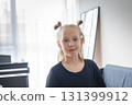 Cute child looking at camera at home. Funny face 131399912