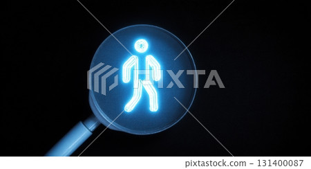 Pedestrian crossing sign glowing blue in darkness 131400087