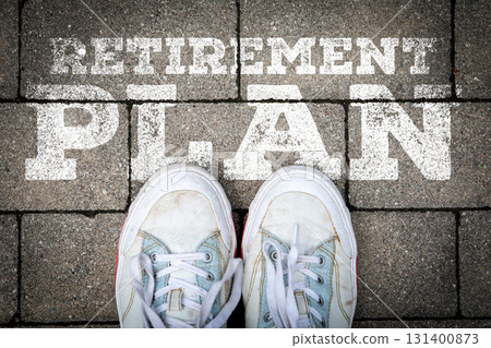 Steps Toward Retirement Plan Concept with Shoes and Chalk Text on Pavement 131400873