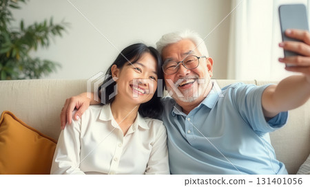 Happy older couple taking a selfie Happy older couple taking a selfie 131401056