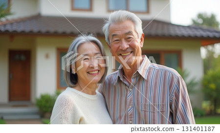 Happy elderly couple and their home 131401187