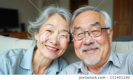 Happy elderly couple at home 131401190