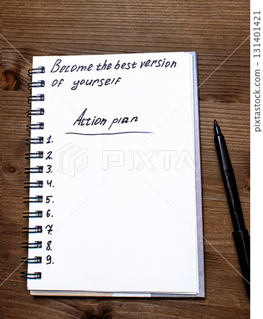The notebook says Become the best version of yourself, top view The notebook says Become the best version of yourself, top view 131401421