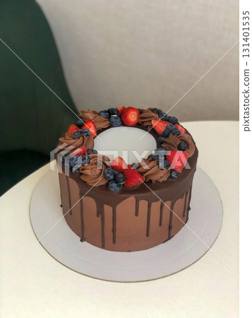 Chocolate Cake with Strawberries and Blueberries 131401535