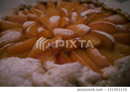 Apricot galette made from cottage cheese dough, dusted with powdered sugar 131401538