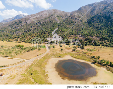 Drying lake in mountain village Omalos in western Crete. Drying lake in mountain village Omalos in western Crete. 131401542