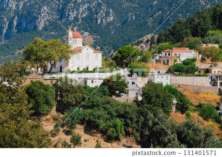 Church and chapel of Agios Mamas in Lakkoi village in Crete mountains on sunny day. 131401571