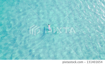 Young man swimming with mask in crystal clear turquoise sea water. 131401654